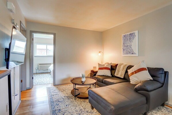 Living area with Roku TV and sectional sofa.