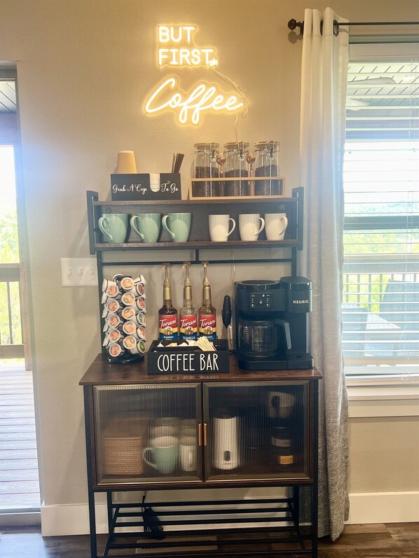 COFFEE BAR Fully stocked coffee bar with all the essentials. We provide a variety of whole bean coffee, k-cups, sweetener and creamers. Also included is a coffee bean grinder, milk frother and steamer and electric kettle.