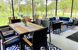 Beautiful screened in patio overlooking the large backyard 