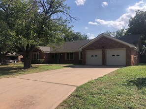 Two Car garage w additional parking on concrete driveway.