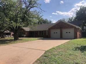 Two Car garage w additional parking on concrete driveway.