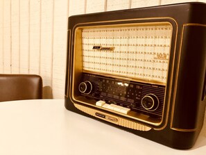 Enjoy peaceful music on the vintage Grundig radio upon arrival