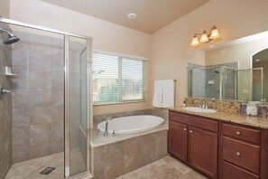 Full Bathroom 1 with toilet, shower, and bathtub.