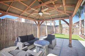 Beautiful backyard and gazebo with outdoor dining, fire pit, and BBQ with propane.