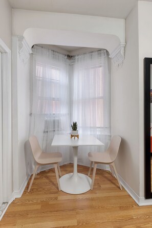 Charming dining area with a rustic table, creating a warm and inviting atmosphere