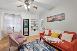 Cozy and welcoming living area with ample seating and a warm, homey atmosphere.