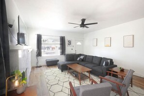 Cozy living room with 50"TV, and Roku.