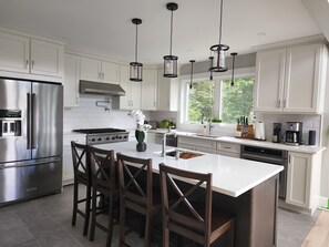 Main kitchen with 36" six-burner Viking gas range and an additional oven