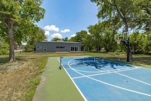 Enjoy a private pickle ball and basketball court at this lakeside home!