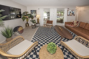 Living room's seating area. Pillows and throws are provided.