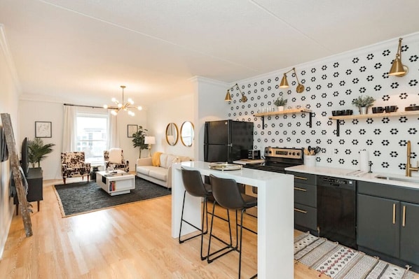 Newly renovated kitchen that opens up into the living room.