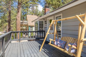 Front deck swing with pillows.  Fenced for pups/kids to enjoy as well.