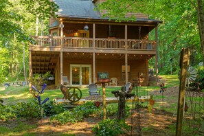 Beautiful backyard with garden, folk art, & fire pit