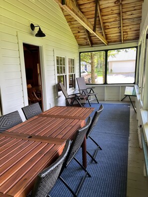 Front screened porch with dining table