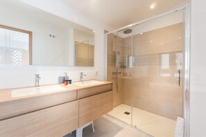 Bathroom with bathtub and shower