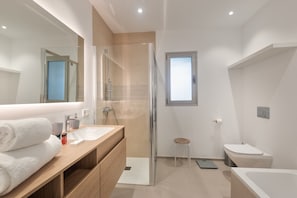 Bathroom with bathtub and shower