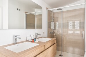 Main bathroom with bathtub and shower