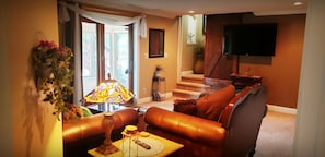 The big living area with big screen smart tv.
