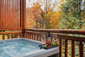 Relax in the hot tub while enjoying the outdoor scenery. 