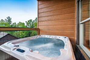 Relax in the 3 person hot tub with privacy and admire the mountain views!