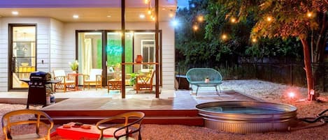 Cozy Outdoor Space With A Hot Tub And Seating Area