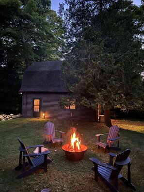 Fire pit with Adirondack chairs