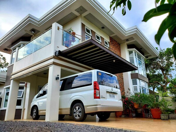 Front of the house. 
12 seater Toyota Grandia for rental with driver inclusive. 