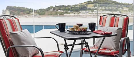 The seating area on the large balcony with river views across the Teign estuary