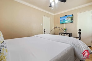 Primary Queen bedroom with TV