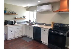 Newly renovated, well stocked kitchen with full size appliances. 