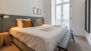 The comfortable bed and lightly decorated room are sure to give you a good night's sleep #cozy #clean #portugal #pt #lisbon