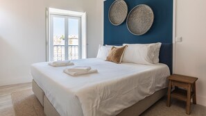 A lightly decorated room, full of natural light, with a comfortable bed #cozy #comfort #portugal #pt #lisbon