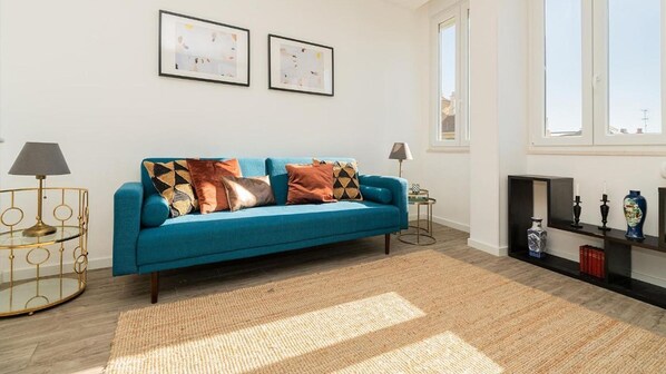 This inviting and bright living room has a comfortable sofa #comfy #bright #portugal #pt #lisbon