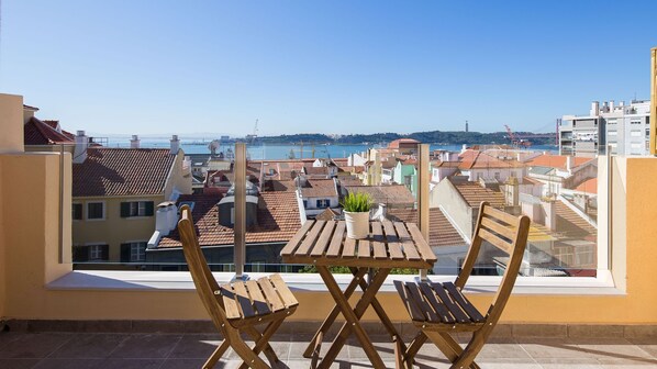 This sunny balcony is the perfect spot for an outdoor meal or a cup of wine, while you enjoy this lovely view #sunny #perfectview #portugal #pt #lisbon