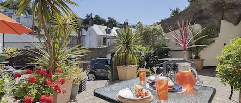 Private courtyard with seating area for you to enjoy some al fresco dining