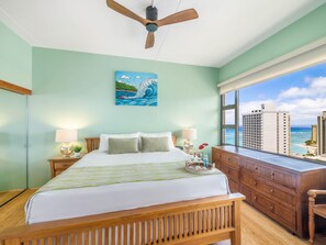 Bedroom with king-size bed, ceiling fan, and Ocean views
