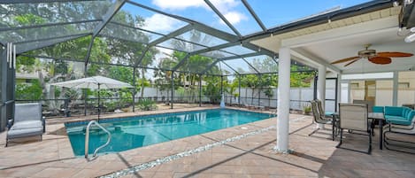 Heated pool with fruit trees in the background