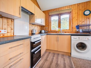Cabinetry, Countertop, Property, Laundry Room, Furniture, Kitchen, Kitchen Stove, Kitchen Sink, Kitchen Appliance, Wood
