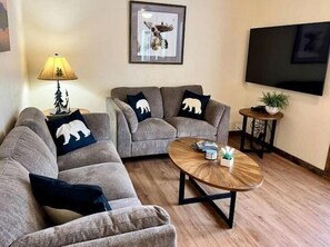 (3) cozy couches and a brand new smart tv