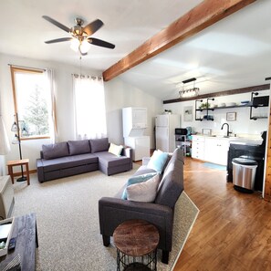 Open floor plan with washer/dryer; well appointed kitchen & stocked coffee bar. 