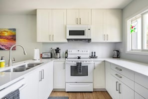 Our open-concept kitchen has everything you need to cook up your favorite dishes during your stay.
