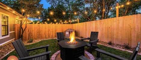 Your very own private yard with fire pit and dog house