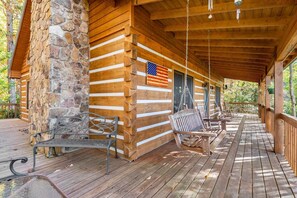 Beautiful covered front porch with swings and rocking chairs