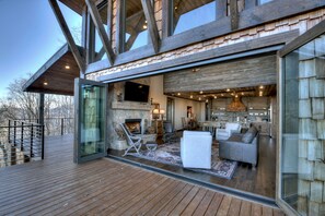 Glass doors on the main level open for an airy living room 