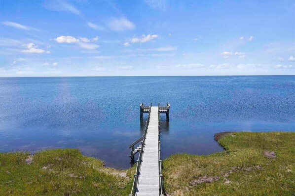 A private walkway and pier provides direct access to the sound's vast playground of possibilities.