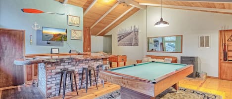 Lounge room with pool & foosball table, redwood slab bar countertop & TV!