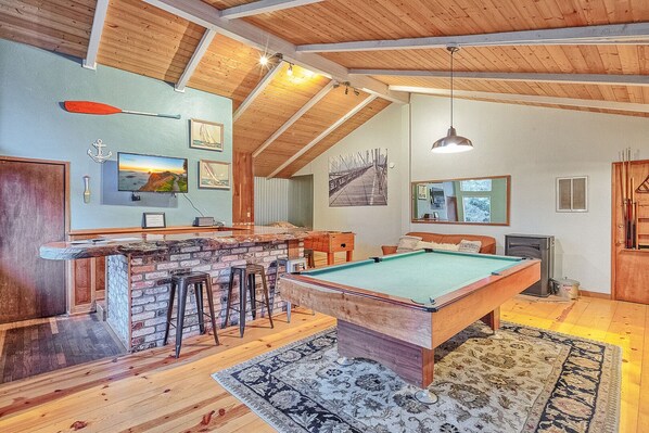 Lounge room with pool & foosball table, redwood slab bar countertop & TV!