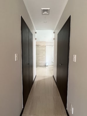 2 walk-in closets before the en-suite bathroom with a safe and luggage space.
