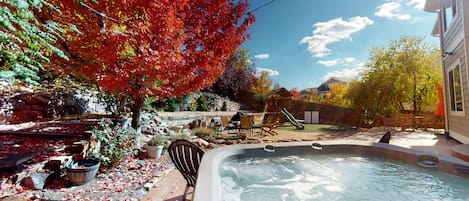 Relax, take in the views of the blue sky in this beautiful backyard