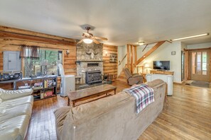 Living Room | Window A/C Unit | Wood-Burning Stove | Smart TV